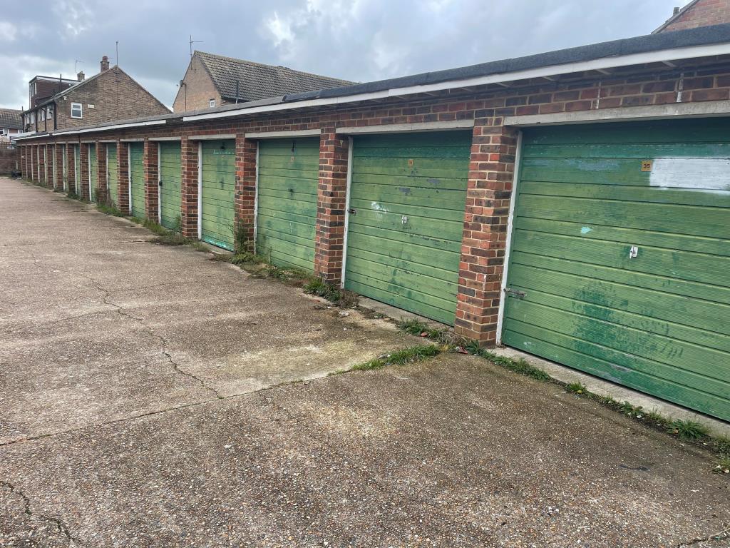 Lot: 123 - SIXTEEN GARAGES IN A COMPOUND - View of garages from northern end